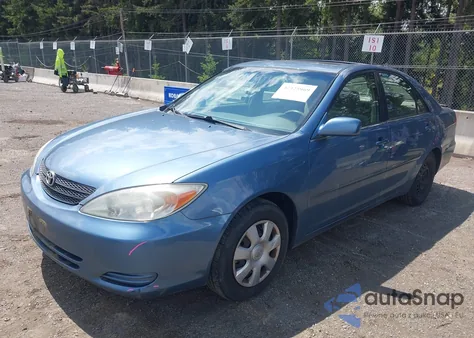 2003 Toyota Camry Le z USA, uszkodzony, nr VIN JTDBE32K130182354